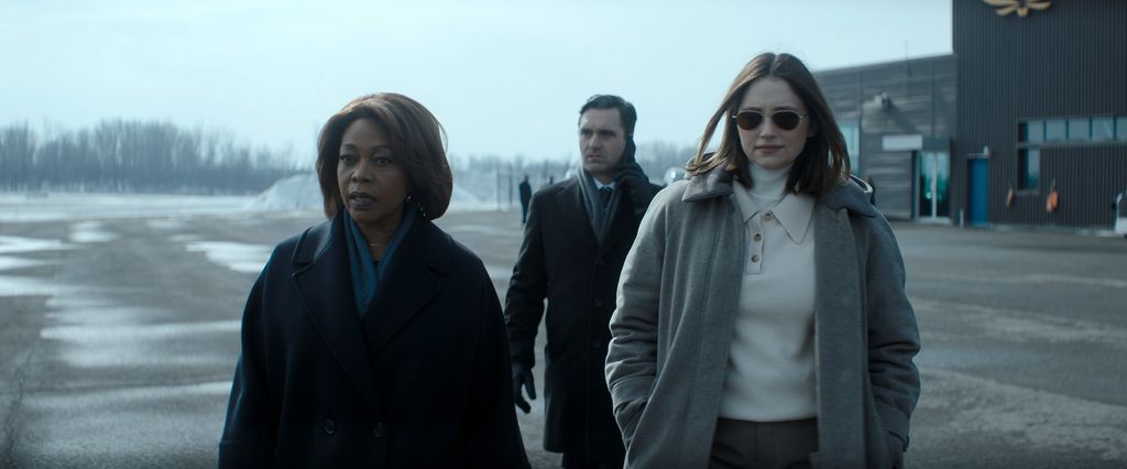 Three people walking in the snow