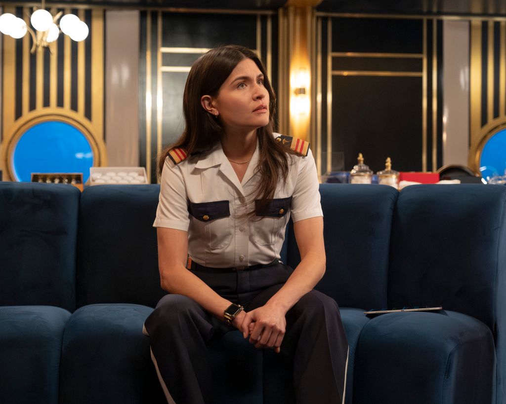woman in uniform sitting on chair