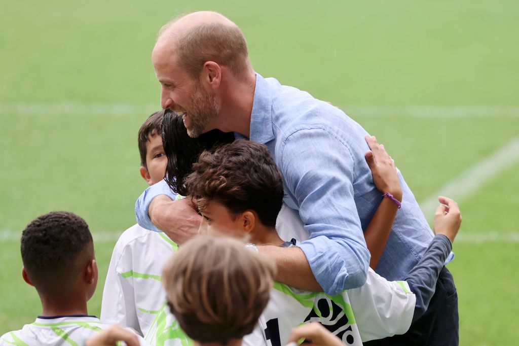 The royal dad of three was swarmed with hugs before leaving.