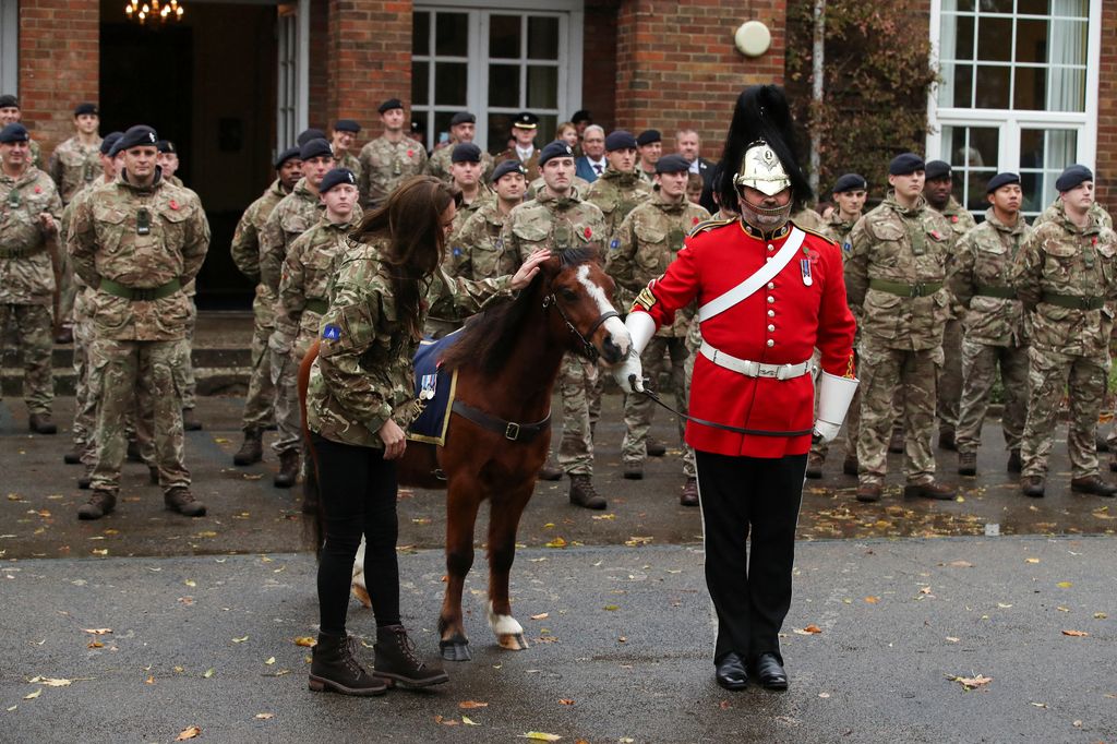 Kate Middleton strokes a pony at military regiment