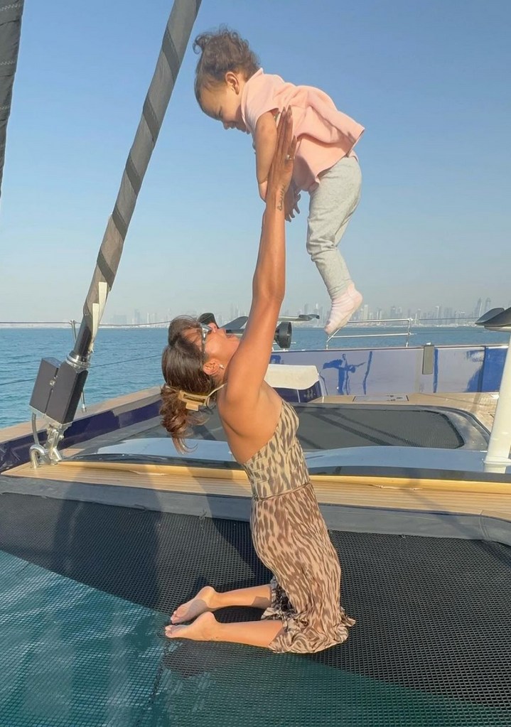 Photo shared by Priyanka Chopra on Instagram March 2024 from a vacation in Dubai in which she is on a boat, lifting her daughter with Nick Jonas, Malti Marie, up in the air.