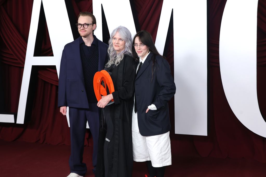 billie eilish in pinstripes with baggy shorts