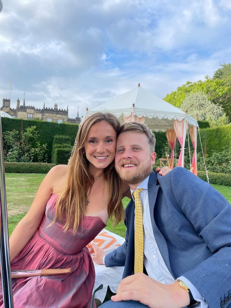 Lady Marina smiling while hugging a friend at the wedding