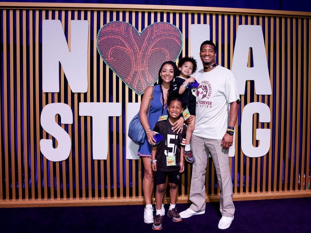 photo of jameis winston with his wife and two sons
