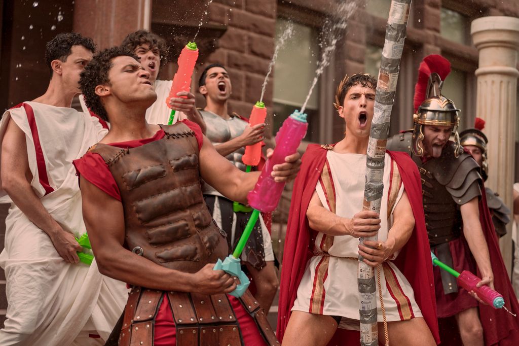 group of men wearing costumes with water guns