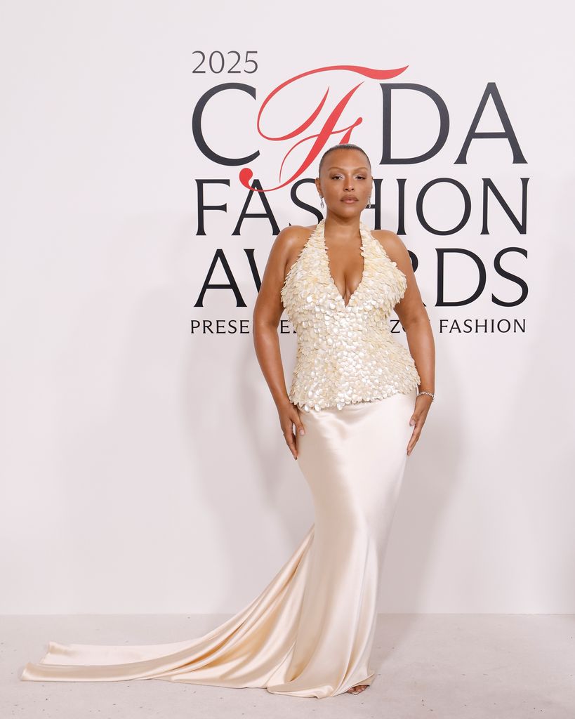 Paloma Elsesser attends the 2025 CFDA Awards at American Museum of Natural History in a cream halterneck dress with beaded bodice