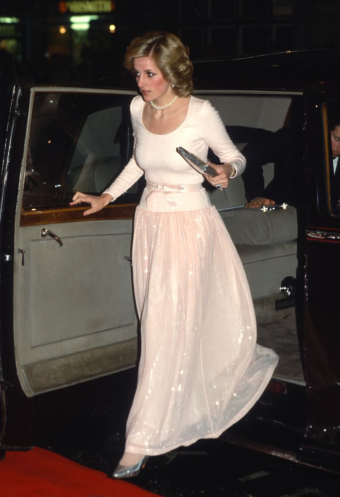 Diana, Princess of Wales arriving in a pale peach dress with long sequin skirt and long sleeves. 