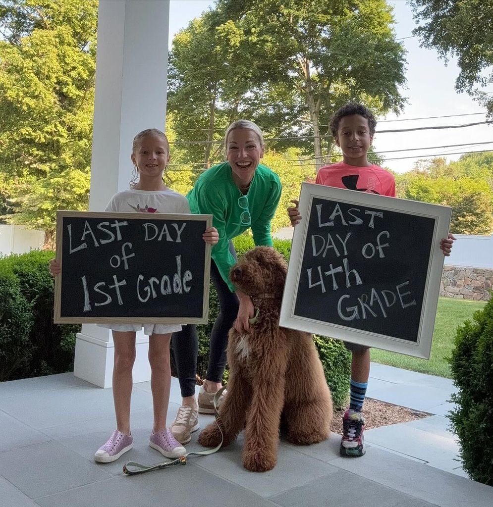 Craig Melvin wife and kids with their dog on porch of home