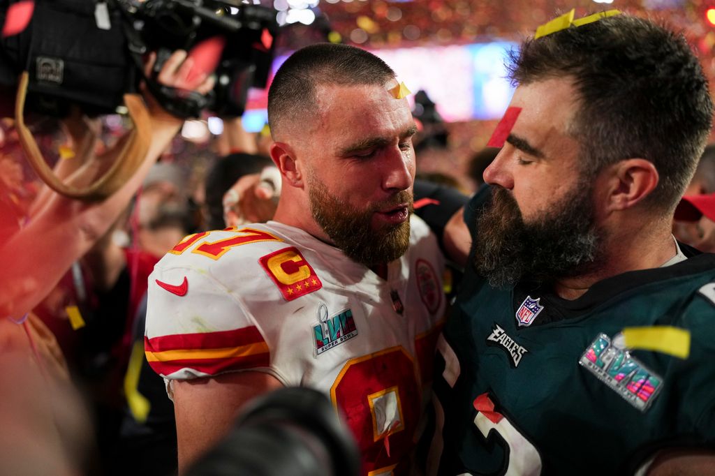 GLENDALE, AZ - FEBRUARY 12: Travis Kelce #87 of the Kansas City Chiefs speaks with Jason Kelce #62 of the Philadelphia Eagles after Super Bowl LVII at State Farm Stadium on February 12, 2023 in Glendale, Arizona. The Chiefs defeated the Eagles 38-35. (Photo by Cooper Neill/Getty Images)