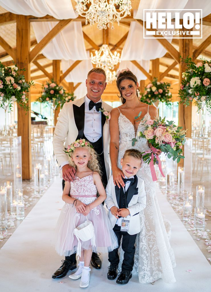 Kym Marsh's daughter is the perfect bride as she stands with new husband, page boy and flower girl