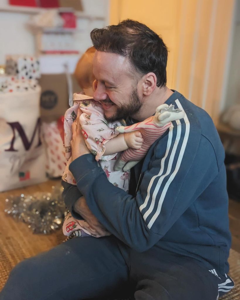 Kevin Clifton shared an adorable photo showing him hugging his daughter during her first Christmas