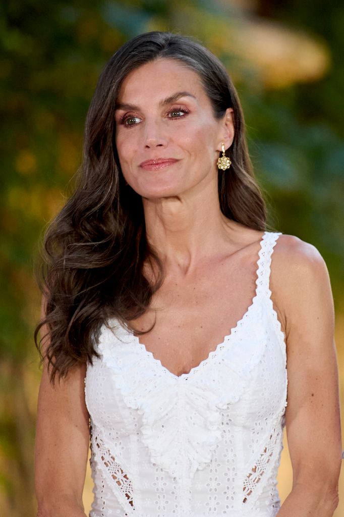 Queen Letizia in white dress and gold earrings