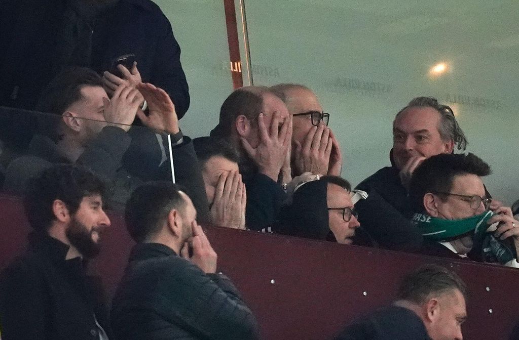 Prince William at a football match with his head in his hands