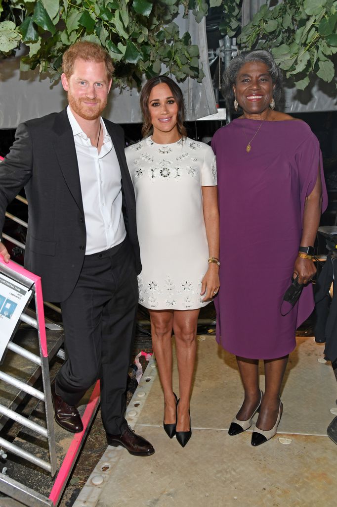 Harry and Meghan in white dress beside Linda Thomas-Greenfield at Global Citizen Live