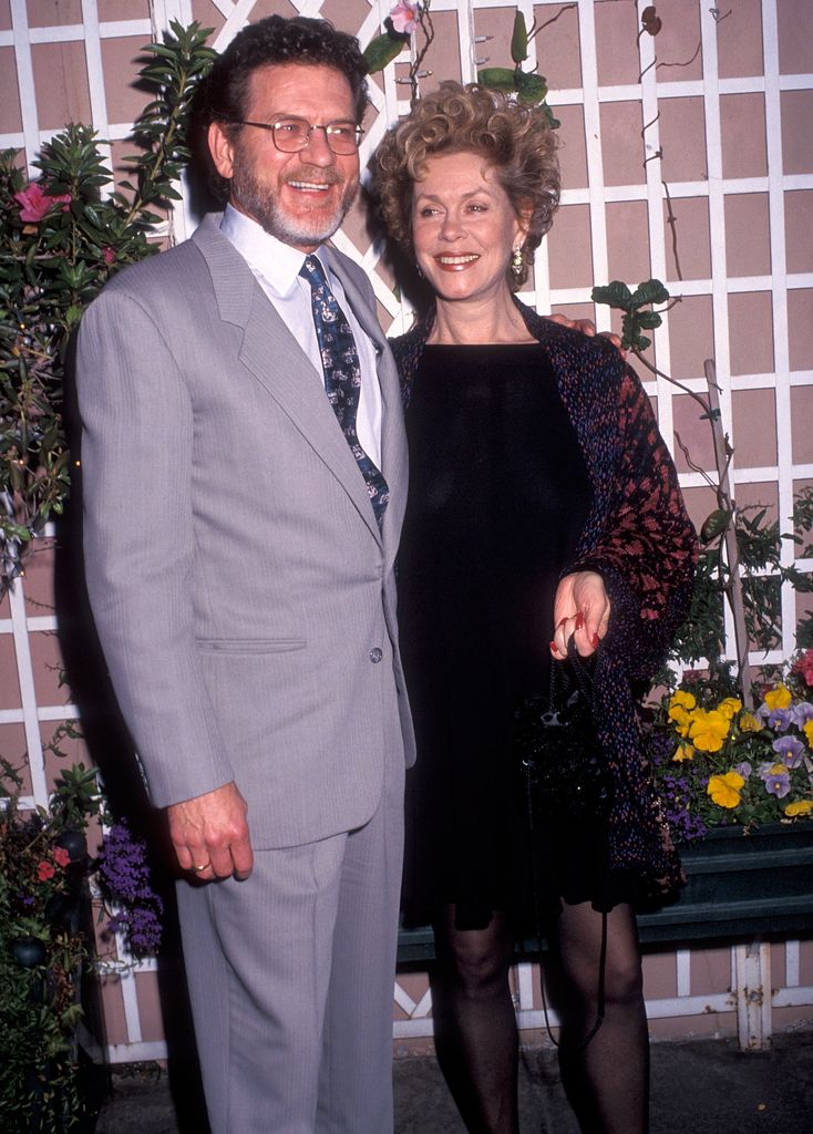 ctor Robert Foxworth and actress Elizabeth Montgomery with their arms around each other 