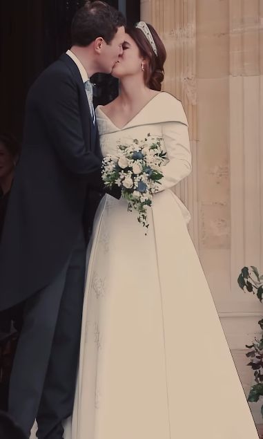 Jack Brooksbank kisses Princess Eugenie on wedding day