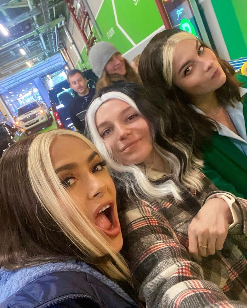 Salma's selfie with Annie and Ally smiling behind her, all dressed as Joan from Black Mirror