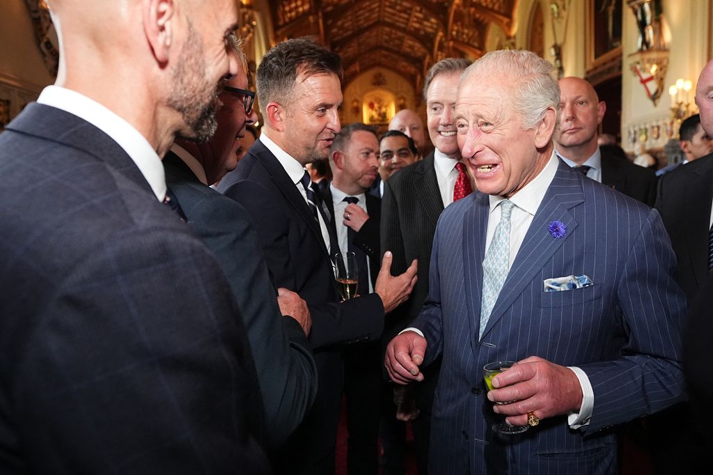 Britain's King Charles III speaks to guests during a reception for recipients of The King's Award for Enterprise