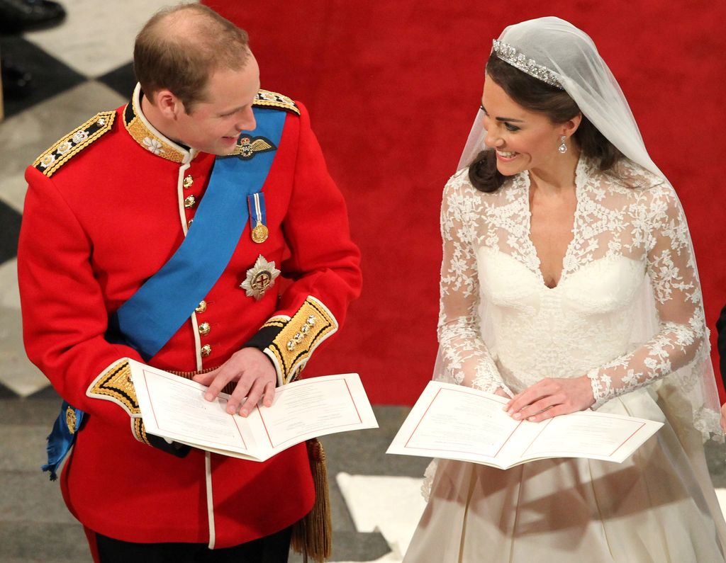 Prince William sings beside his bride Catherine Middleton during their wedding at Westminster Abbey in 2011