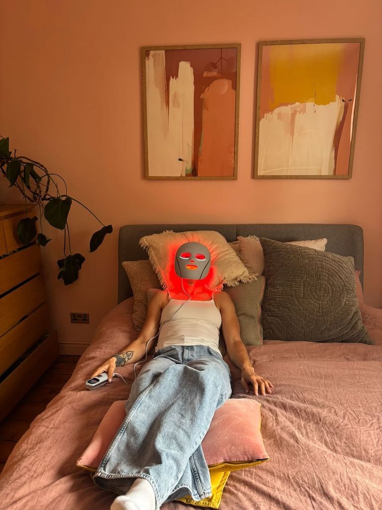 Lucy Bronze in a face mask on her bed