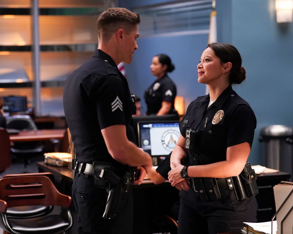 Tim Bradford and Lucy Chen speak in the police station in The Rookie