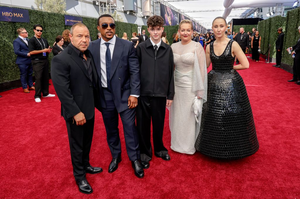 Owen Cooper with the cast and crew from Adolescence