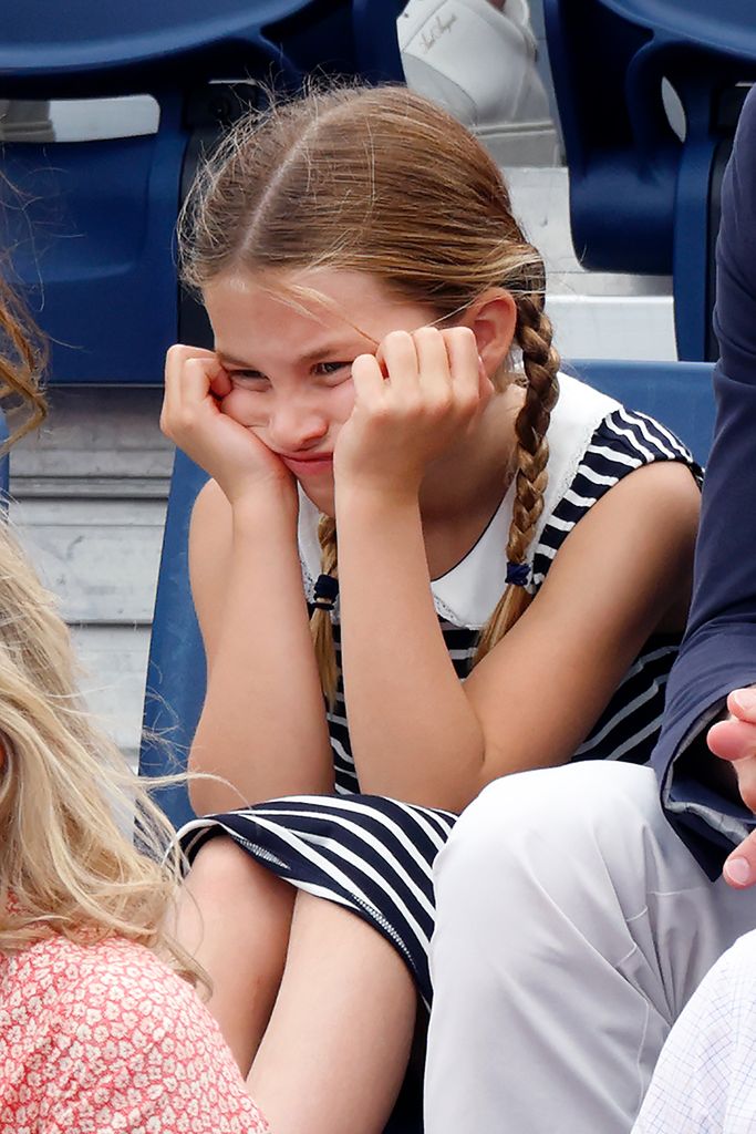Princess Charlotte with face in hands