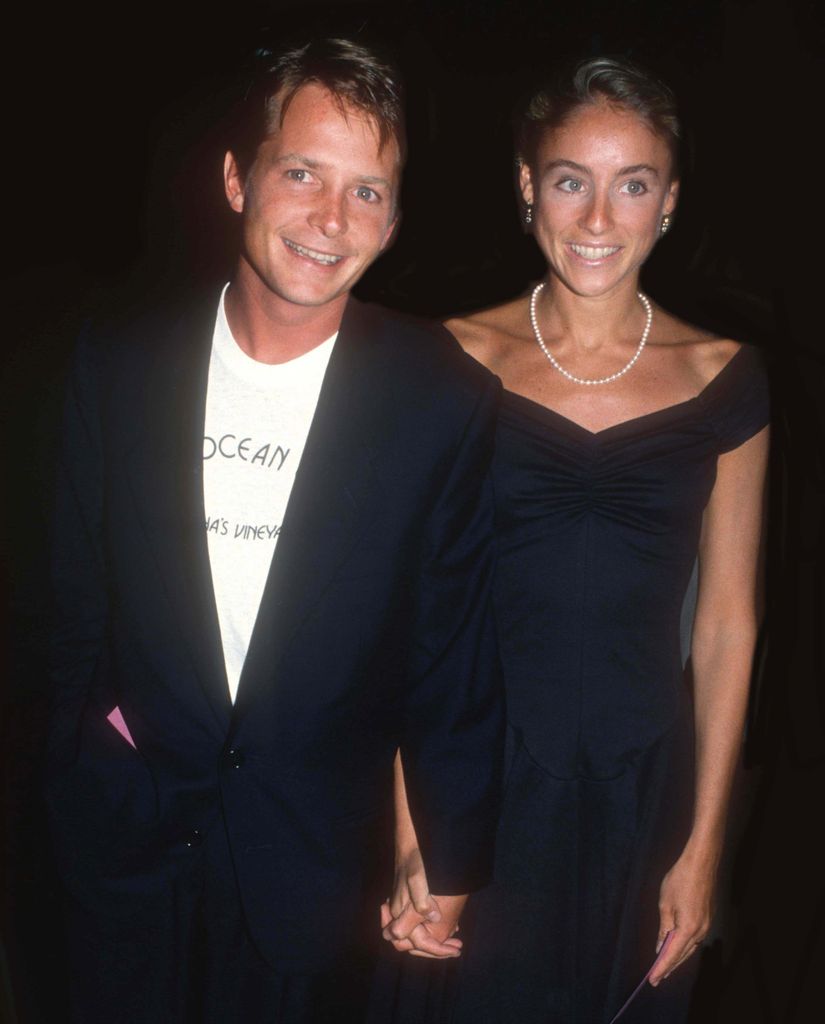 Michael J Fox and Tracy Pollan holding hands in 1988. 