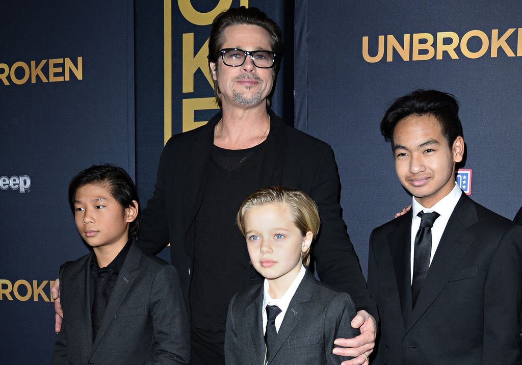 Brad Pitt with his children Pax, Shiloh, and Maddox at the Unbroken premiere