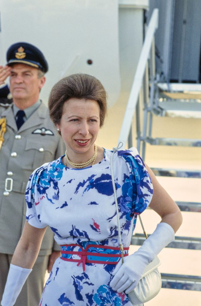 British Royal Princess Anne, Princess Royal wearing a blue and white print pattern dress with red detail, a red belt and white evening gloves during a visit to Los Angeles, California, July 1984
