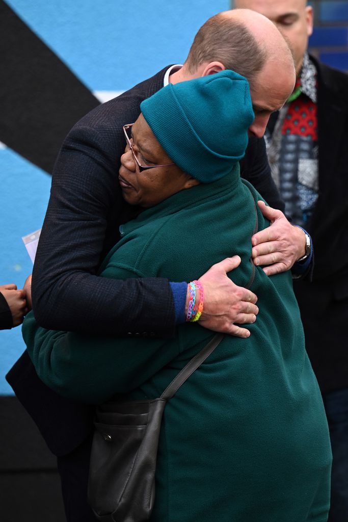 Prince William hugging a Black woman
