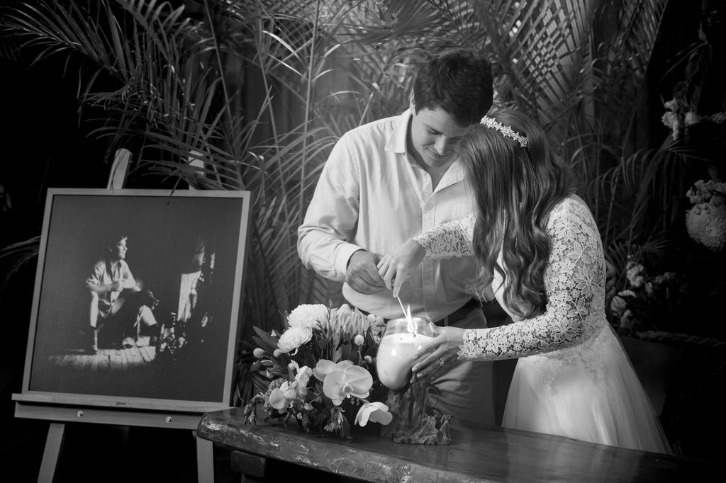 Bindi Irwin and Chandler light a candle on their wedding day for Steve Irwin