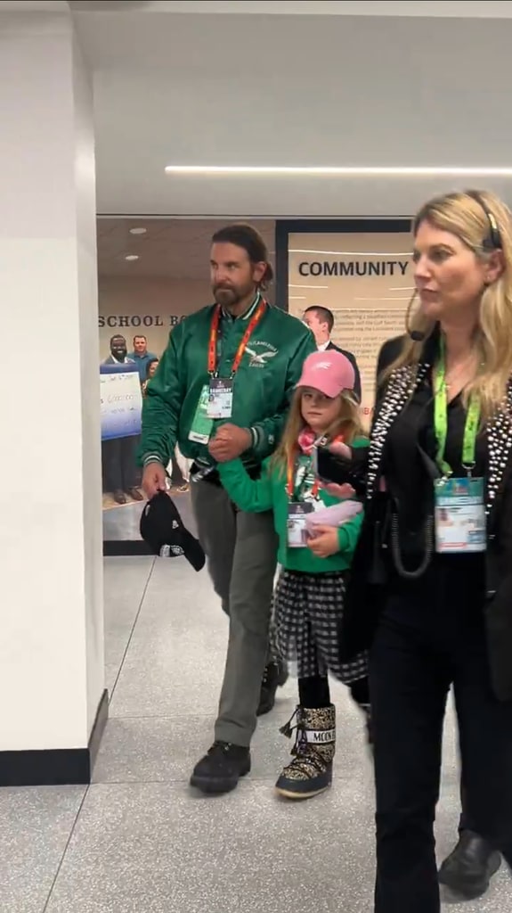 Bradley Cooper and his daughter Lea De Seine walk into the Caesars Superdome ahead of Super Bowl LIX