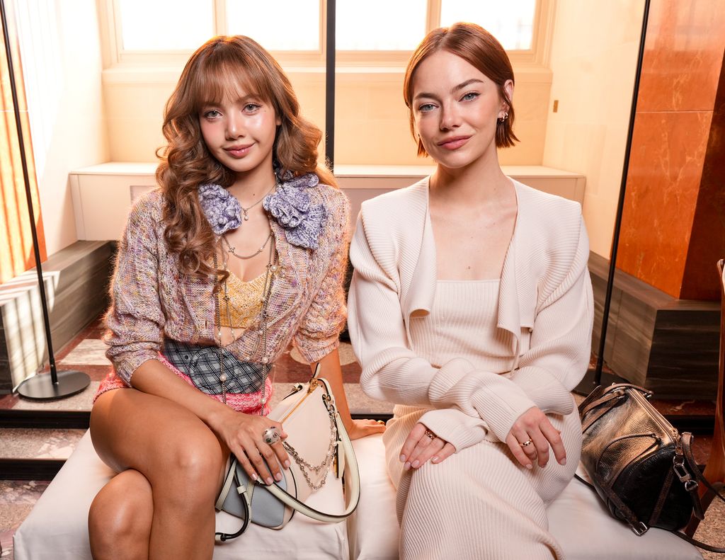 photo of blackpink's lisa and emma stone at louis vuitton pfw