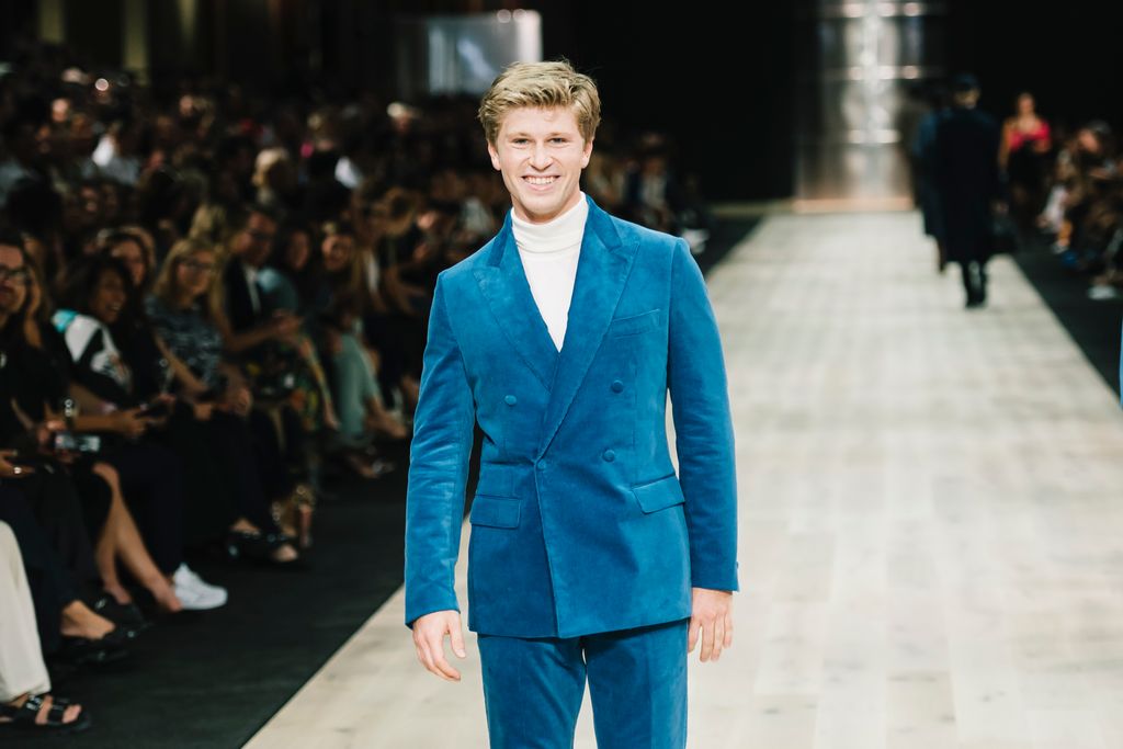 Robert Irwin showcases designs by Godwin during the Suit Up Runway 
