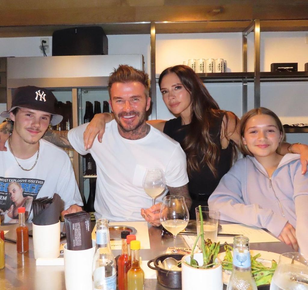 Victoria Beckham wore a sleeveless black vest and fitted trousers for dinner