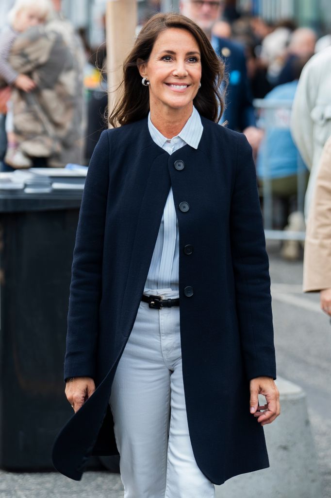 Princess Marie smiling in collared shirt and navy coat