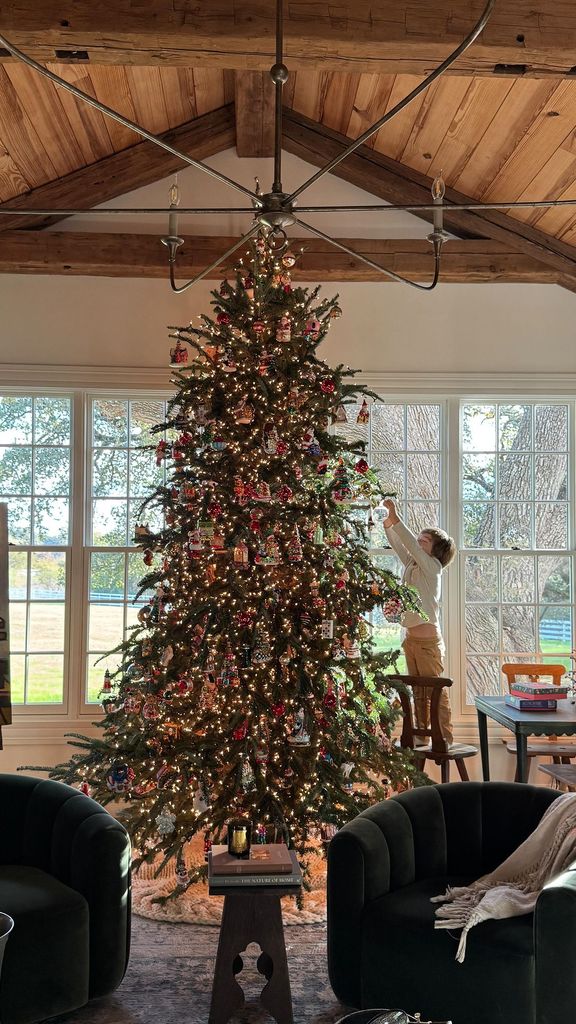 Joanna and Chip Gaines' son Crew decorates the family Christmas tree, shared on Instagram