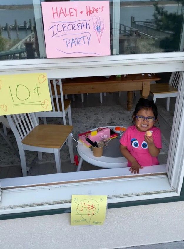Hoda Kotb's daughter looks out the window of her dining room