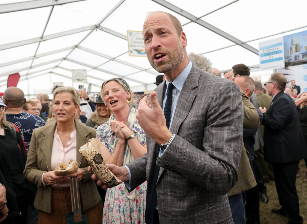 Prince William holding a pasty
