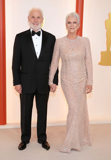 christopher guest and wife jamie lee curtis hand in hand at oscars 2023
