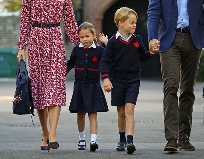 Princess Charlotte waves as she arrives at school