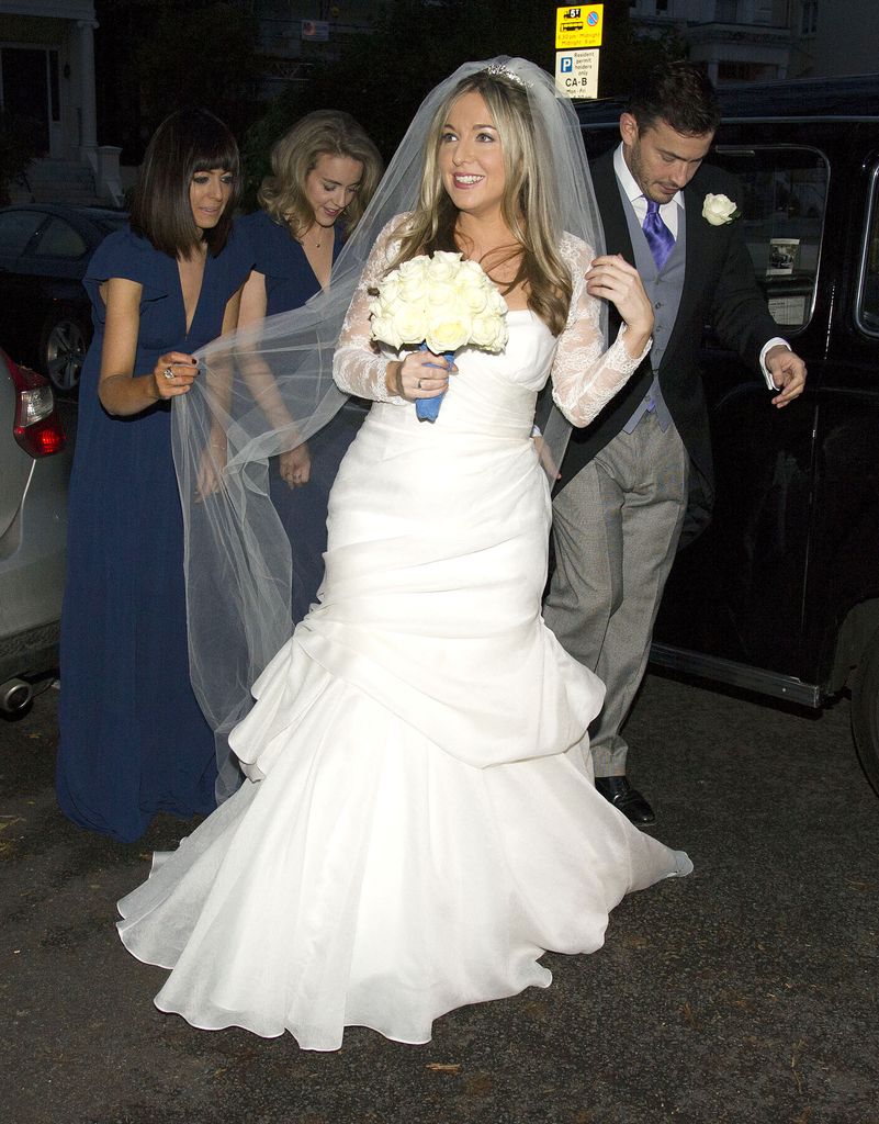 Claudia Winkleman holding Victoria Coren's veil