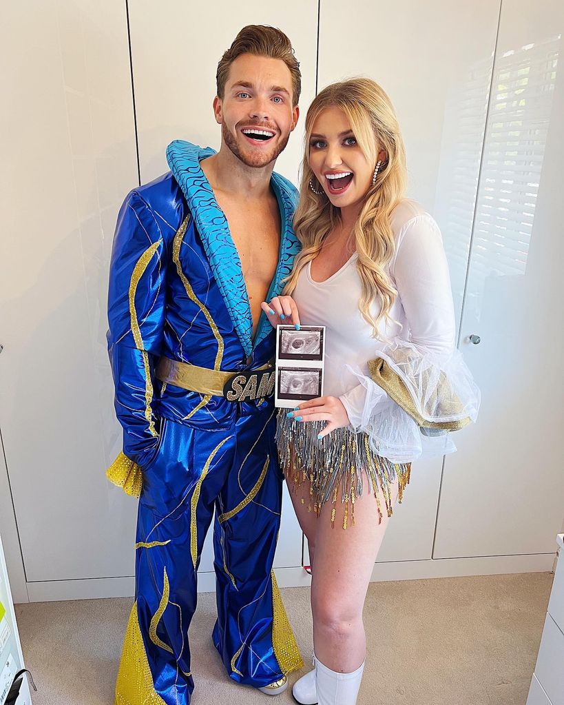Amy and Sam in abba costumes holding ultrasound pictures