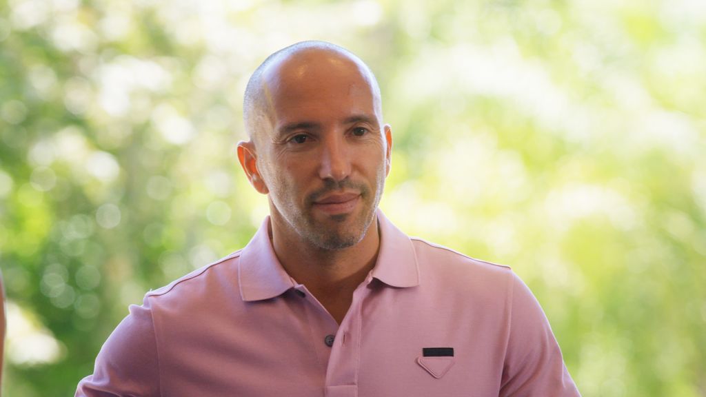 Close up of Jason Oppenheim wearing a pink polo top in Selling Sunset 