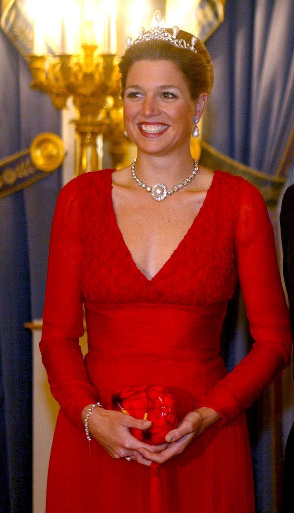 young Princess Maxima in red gown with a diamond and pearl tiara 