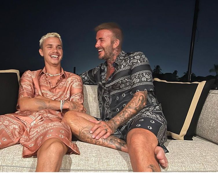 David and Romeo Beckham wearing matching outfits 