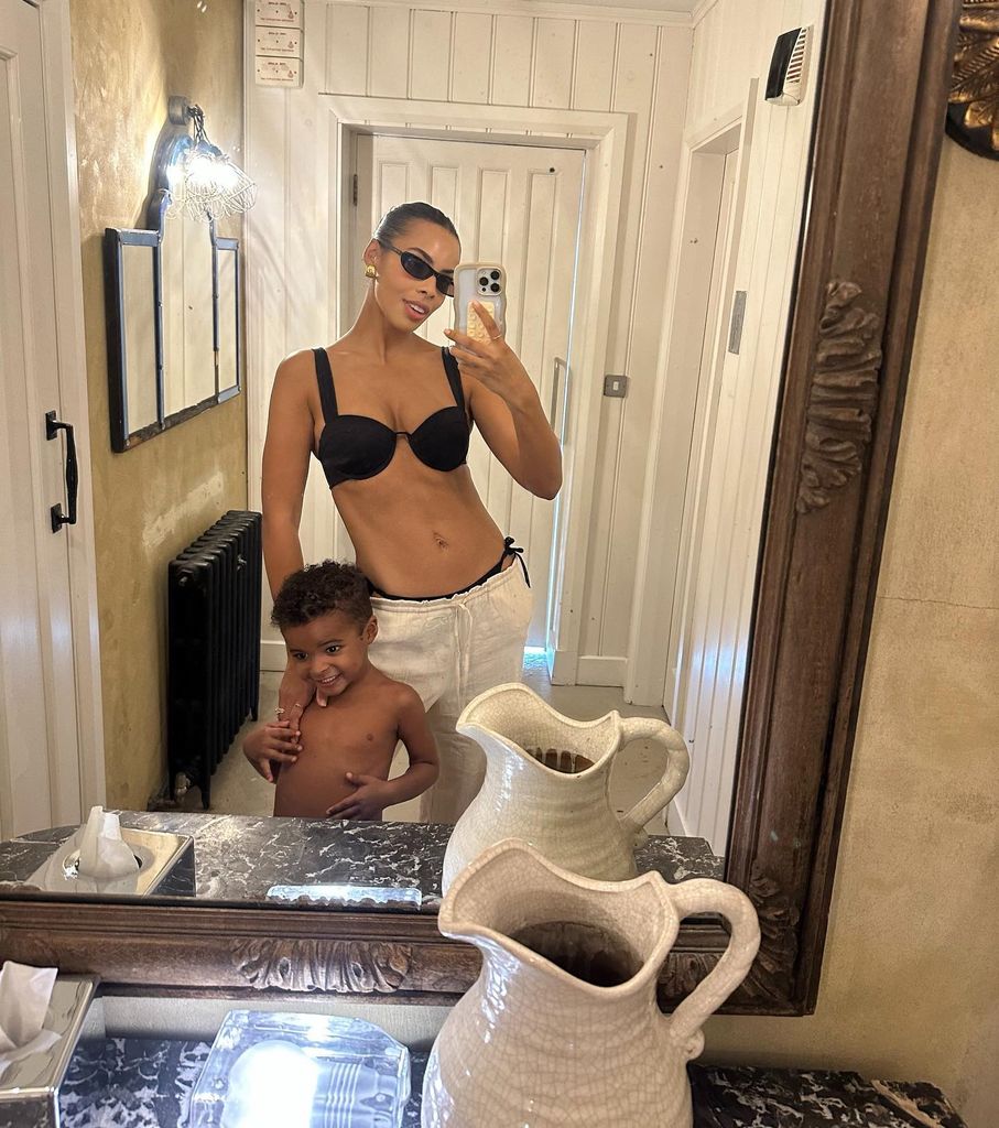 Rochelle Humes in a black bikini top with her son 