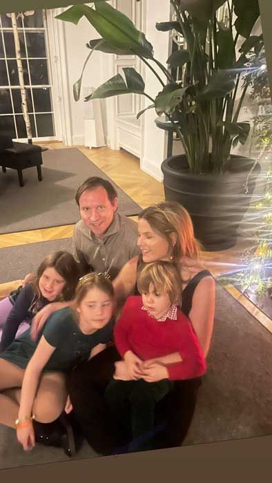 Jenna Bush Hager sitting on the floor with her family