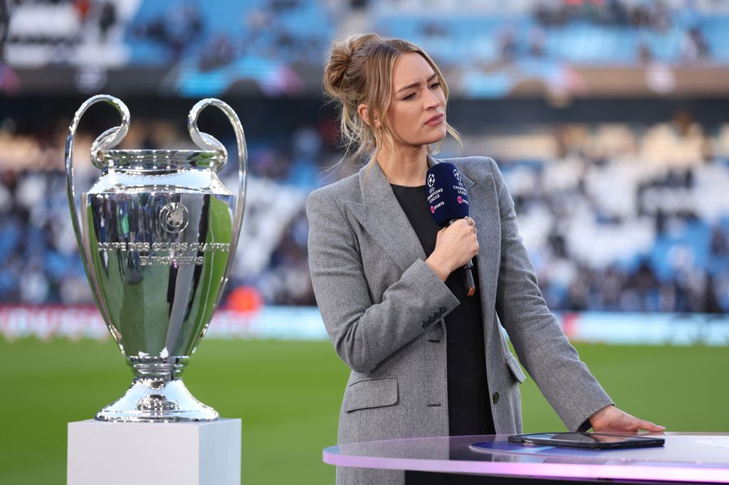 Laura Woods standing with a trophy